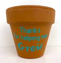 planter with the words thanks for helping me grow on the side